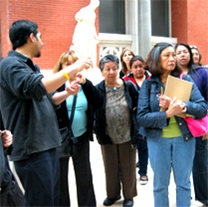 A group of immigrant adults attending a tour at the Queens Museum of Art.