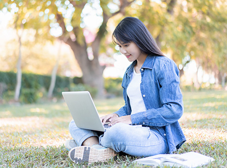 Student with laptop doing homework, making video call using internet, data.
