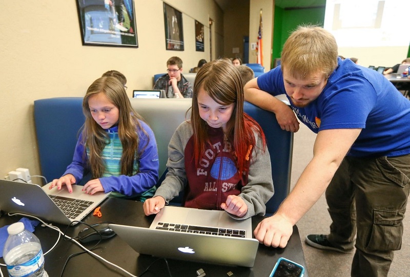 Teen girls with laptops