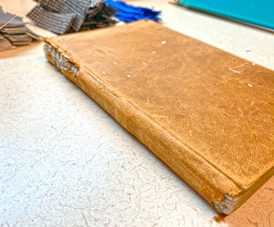 A leatherbound book from 1861 was donated from a private collection for testing. Photo courtesy of Battelle.
