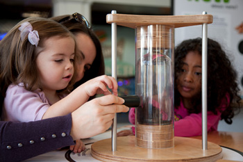 Children learn how to magnetize carbon nanotubes in Port Discovery’s NANO exhibit