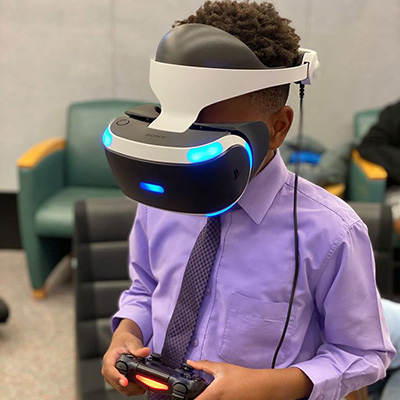 boy wearing a virtual reality headset