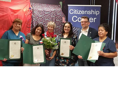 group of award recipients stand for photo