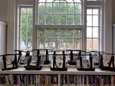 tote bags filled with books set on top of table