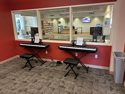 two keyboards setup in music room