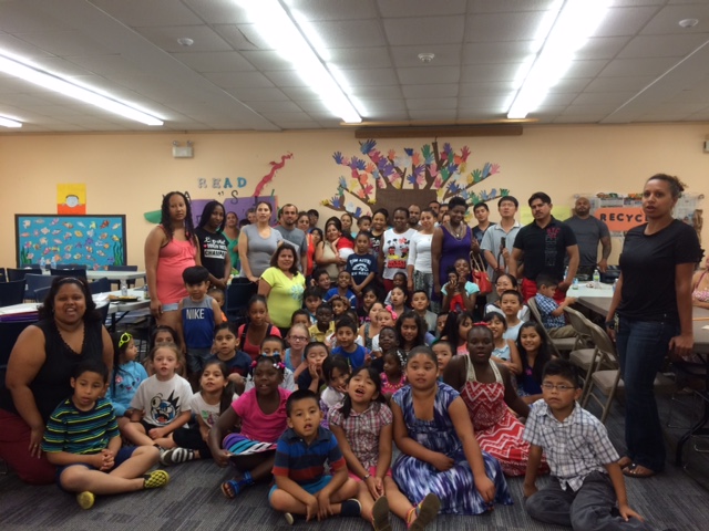 A group of learners at the New Haven Free Public Library celebrate after a day of successful programming. 