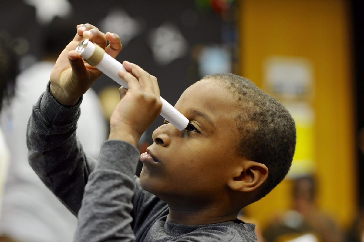 A young student participates in summer learning activity at the Chicago Public Library. 