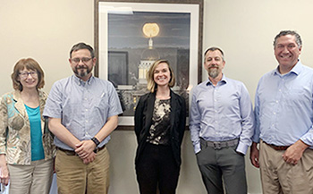 IMLS staff member Madison Bolls (center) with members of Maine InfoNet.