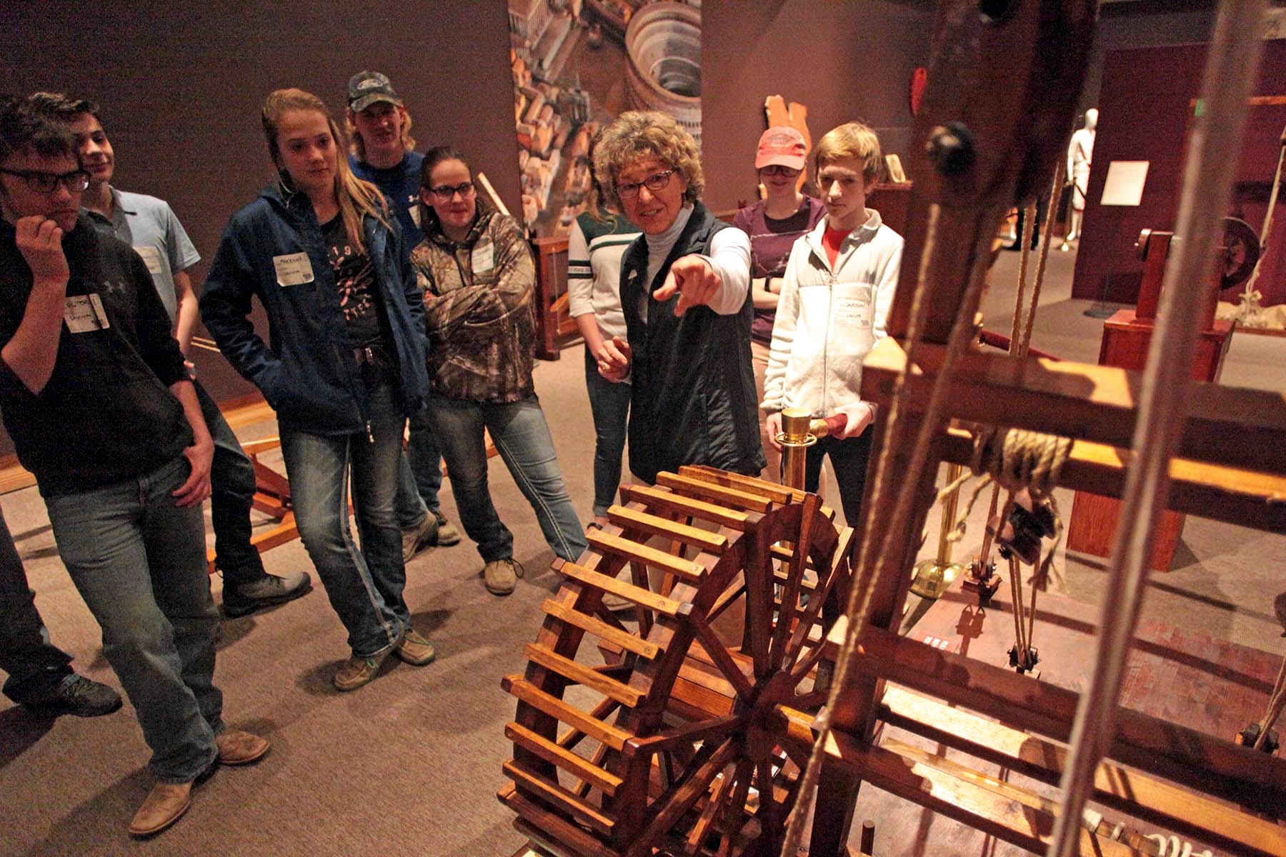 a docent leads a group of students on a tour
