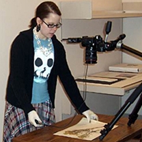 library technctian photographs a specimen