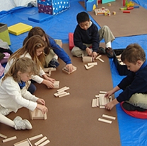 New Orleans children enjoy block building activities as part of the PlayHelps program.