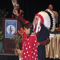 Gordon Yellowman, a Cheyenne Peace Chief, performs a sage blessing at the beginning of the conference, along with his daughter, Cricket.