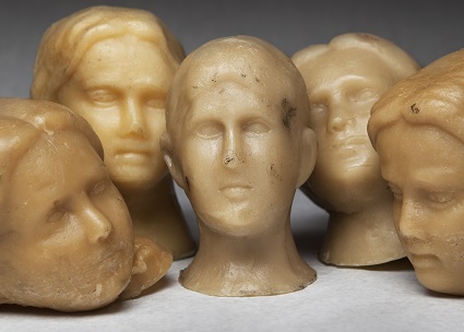 Wax ex-voto heads from Ann Hamilton’s installation, Offering.