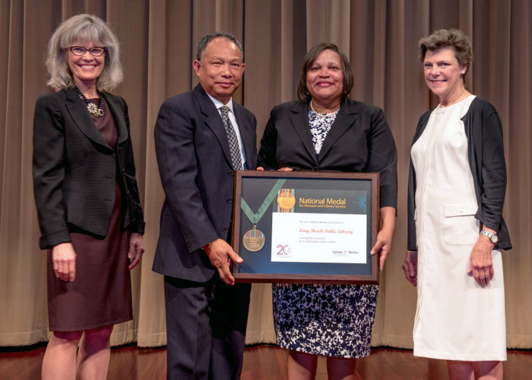 2017 National Medal recipient on stage with IMLS director and guest speaker