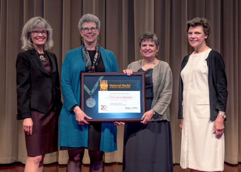 2017 National Medal recipient on stage with IMLS director and guest speaker