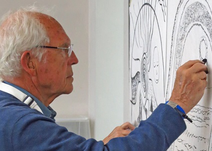 A here:now studio class participant produces charcoal drawings during one of his weekly art-making classes.