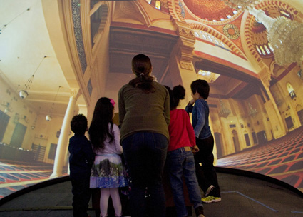 The exhibition’s enclosed theater enables families to experience immersive images of the interiors of mosques from around the world.