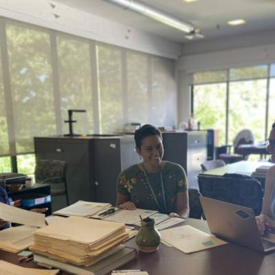 Summer interns sitting at table