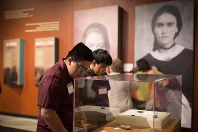 Two museum visitors view the Borderlands of Southern Colorado exhibit.