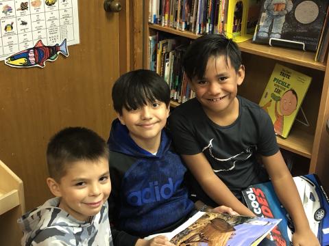 Nooksack Boys sharing books Children's library