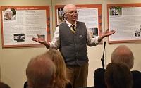 Vietnam Veteran Bill Hinderer hosts a story slam during a night of storytelling at the Maine Historical Society. Public programming further demonstrates the importance of individual stories and encourages individuals to share their stories online.
