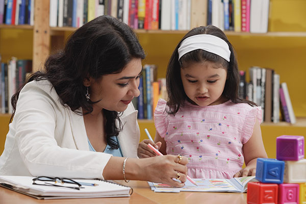 woman and child reading library books