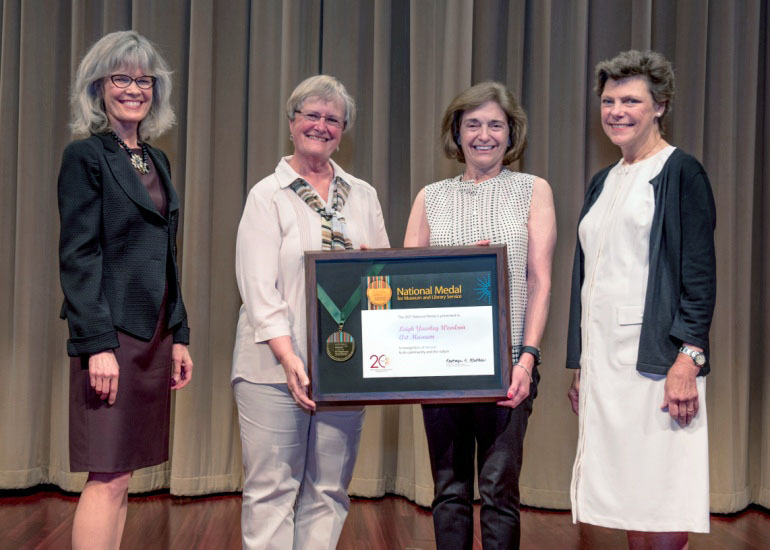 2017 National Medal recipient on stage with IMLS director and guest speaker