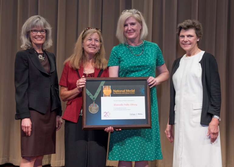 2017 National Medal recipient on stage with IMLS director and guest speaker